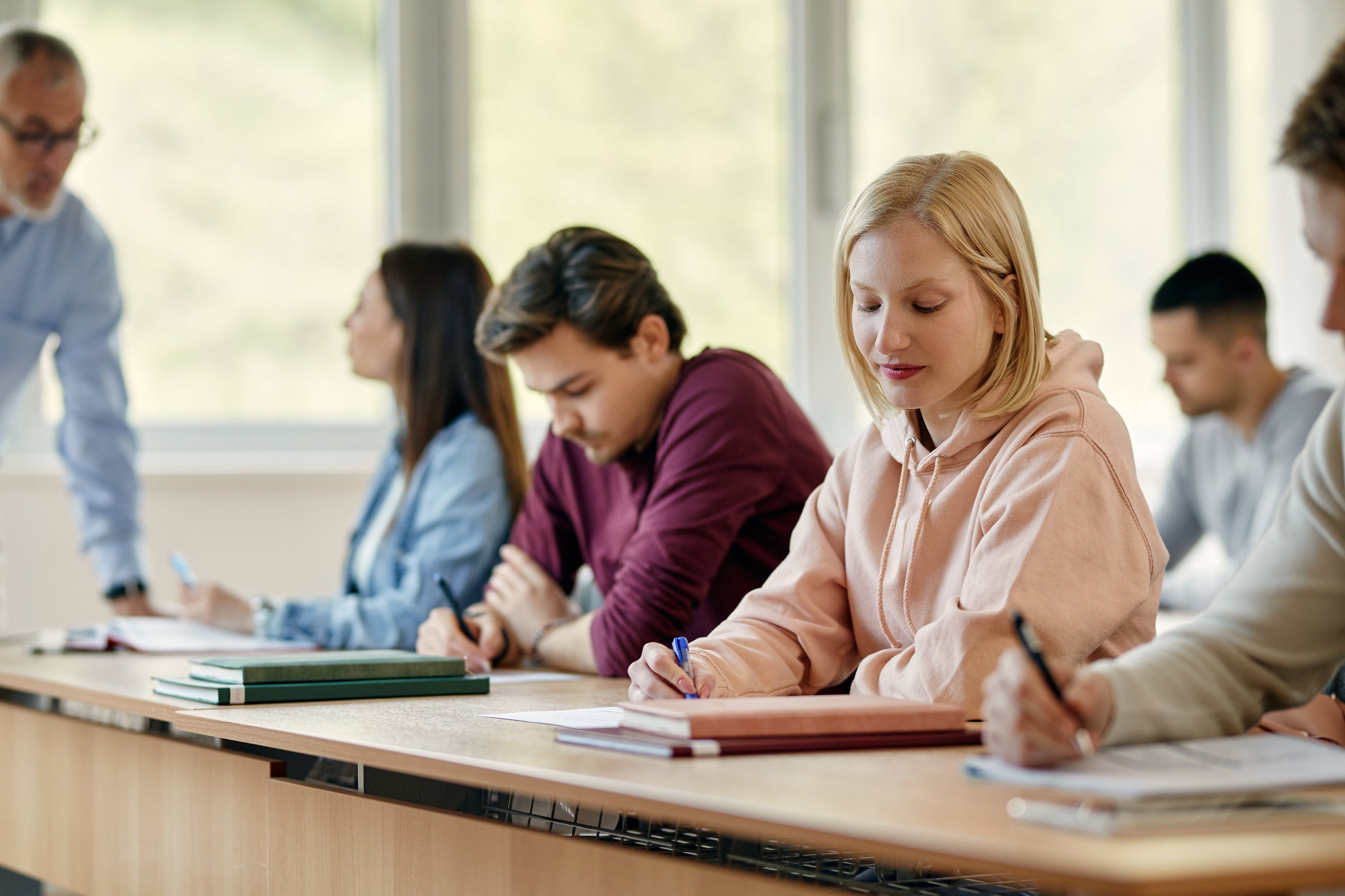 female university student writing